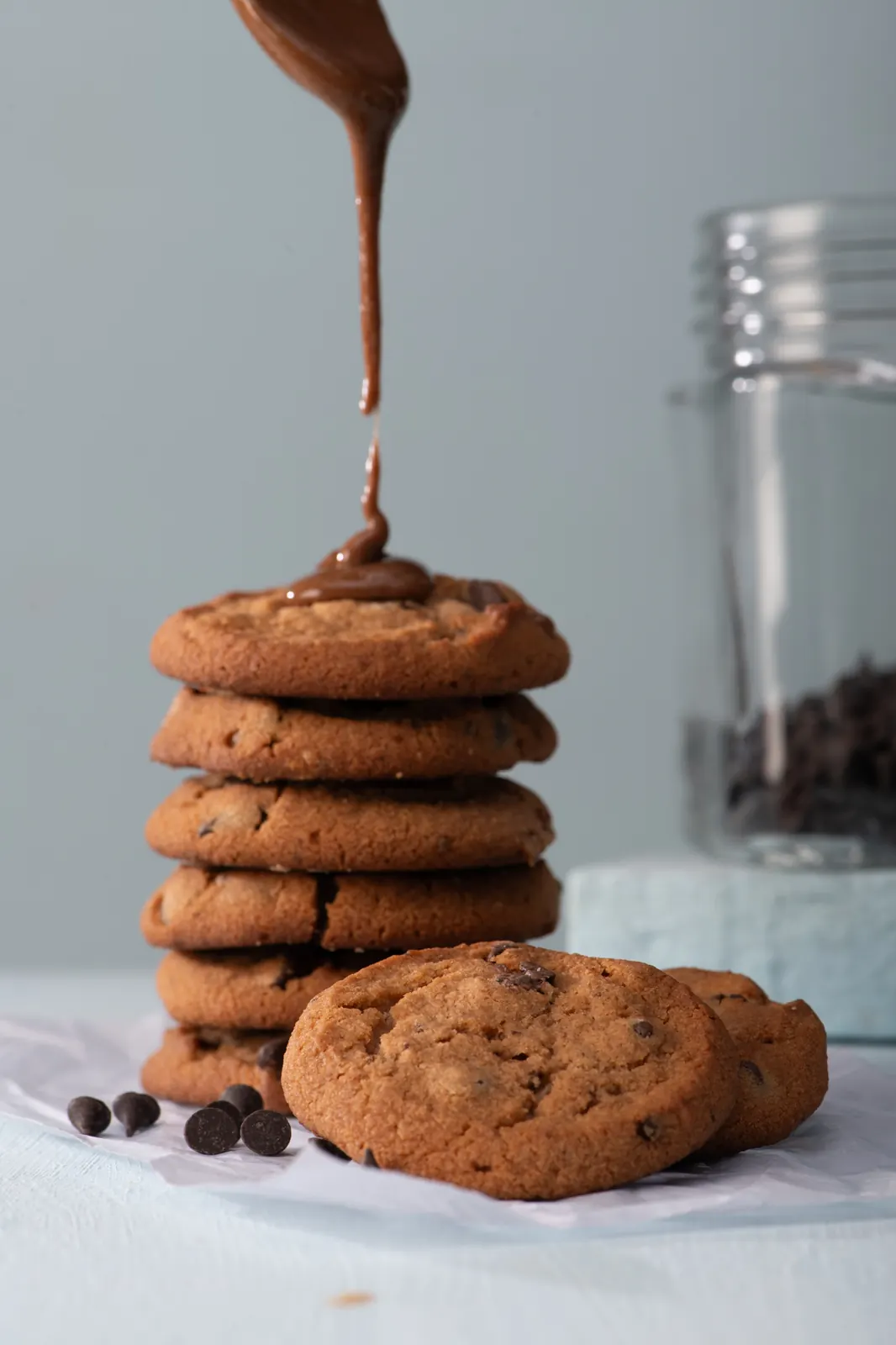 A chocolate cookie with a drip